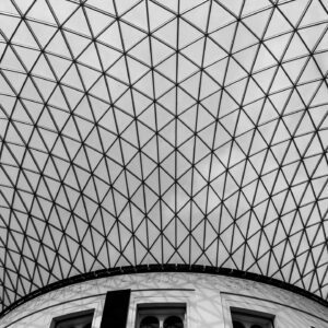 Geometric glass ceiling with crisscross pattern.