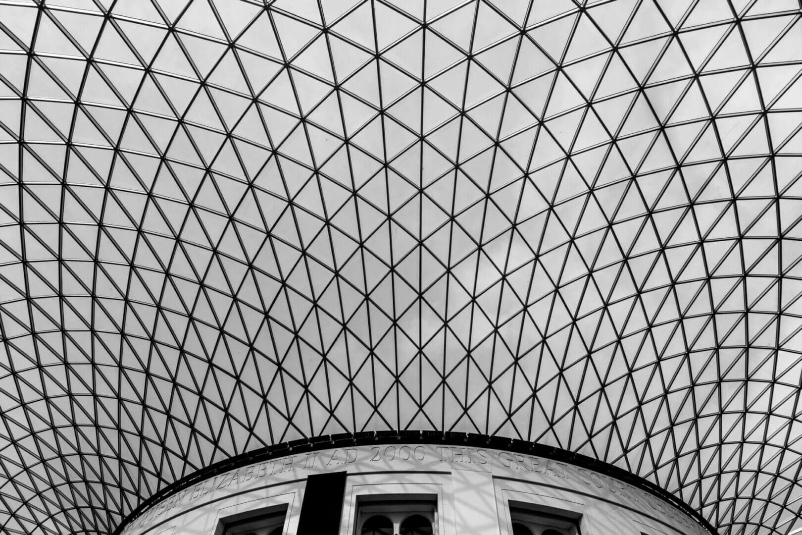 Geometric glass ceiling with crisscross pattern.
